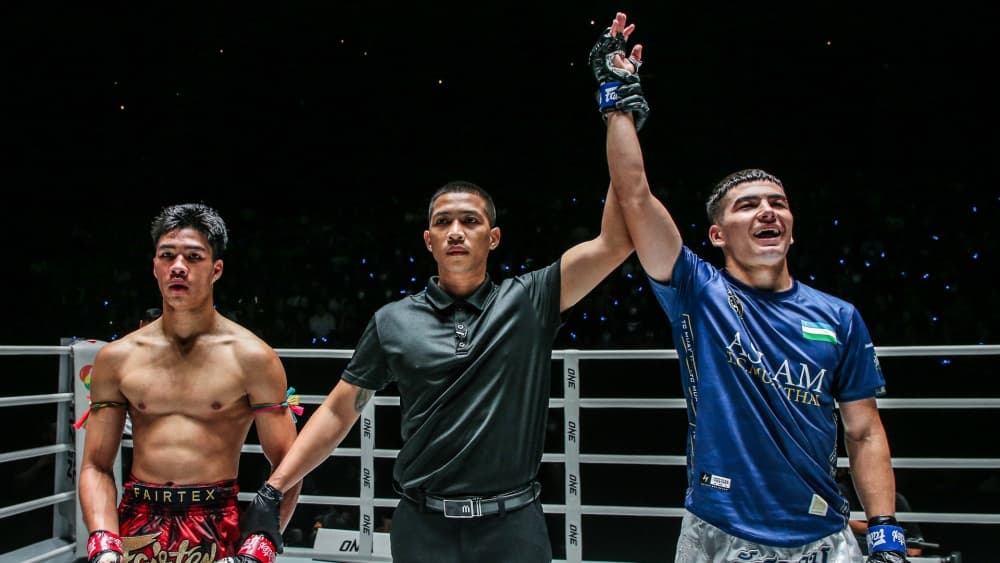 The referee announces the judges’ decision and names the winner.. Photo by ONE Championship