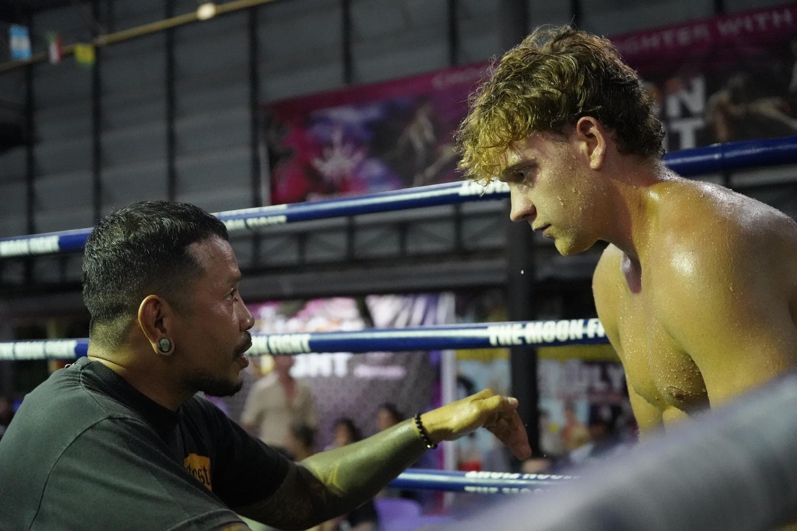 Luca in the ring with his trainer, Kru Keng