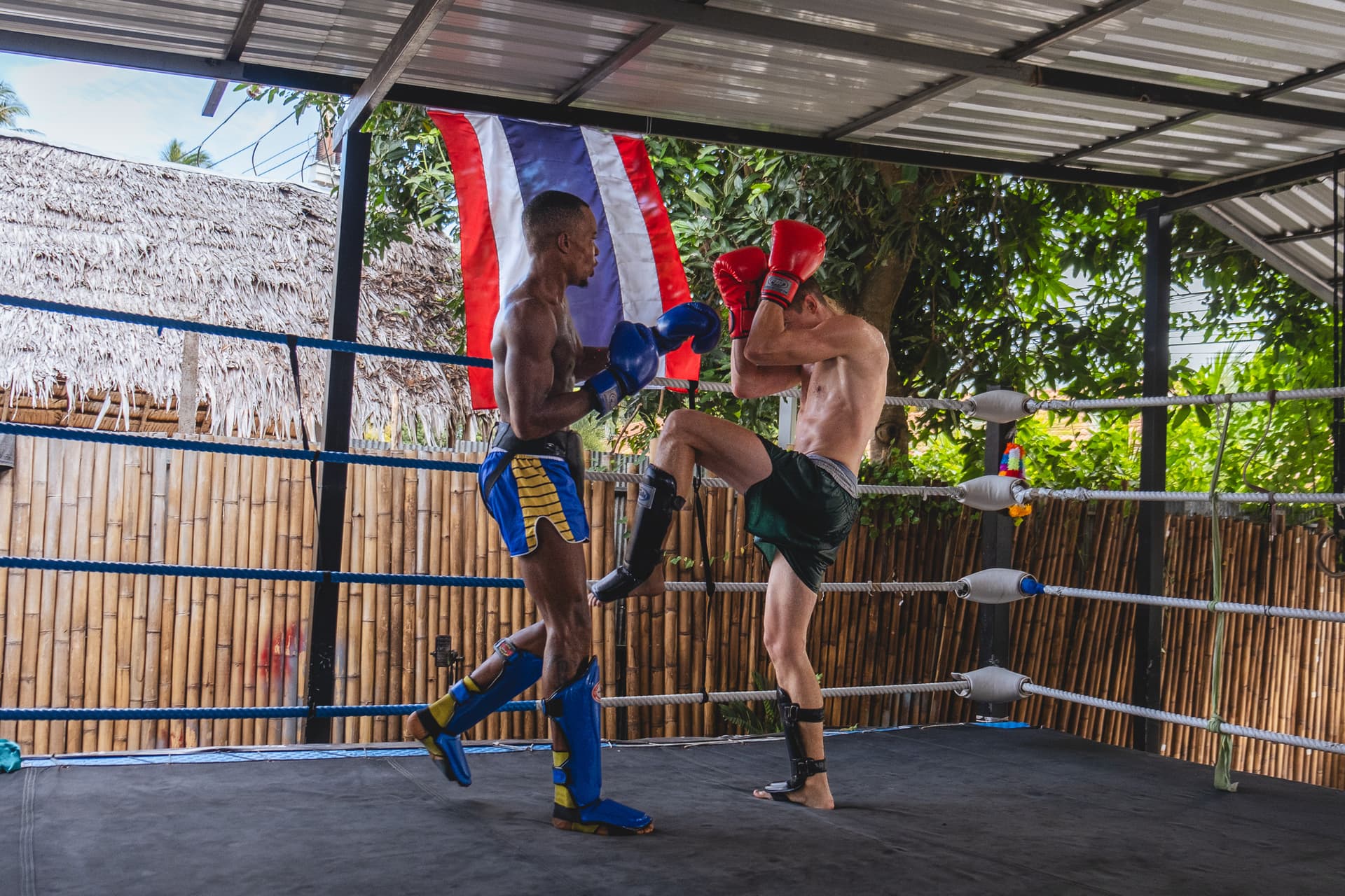 Muay Thai Fighter blocks kick during controlled sparring session