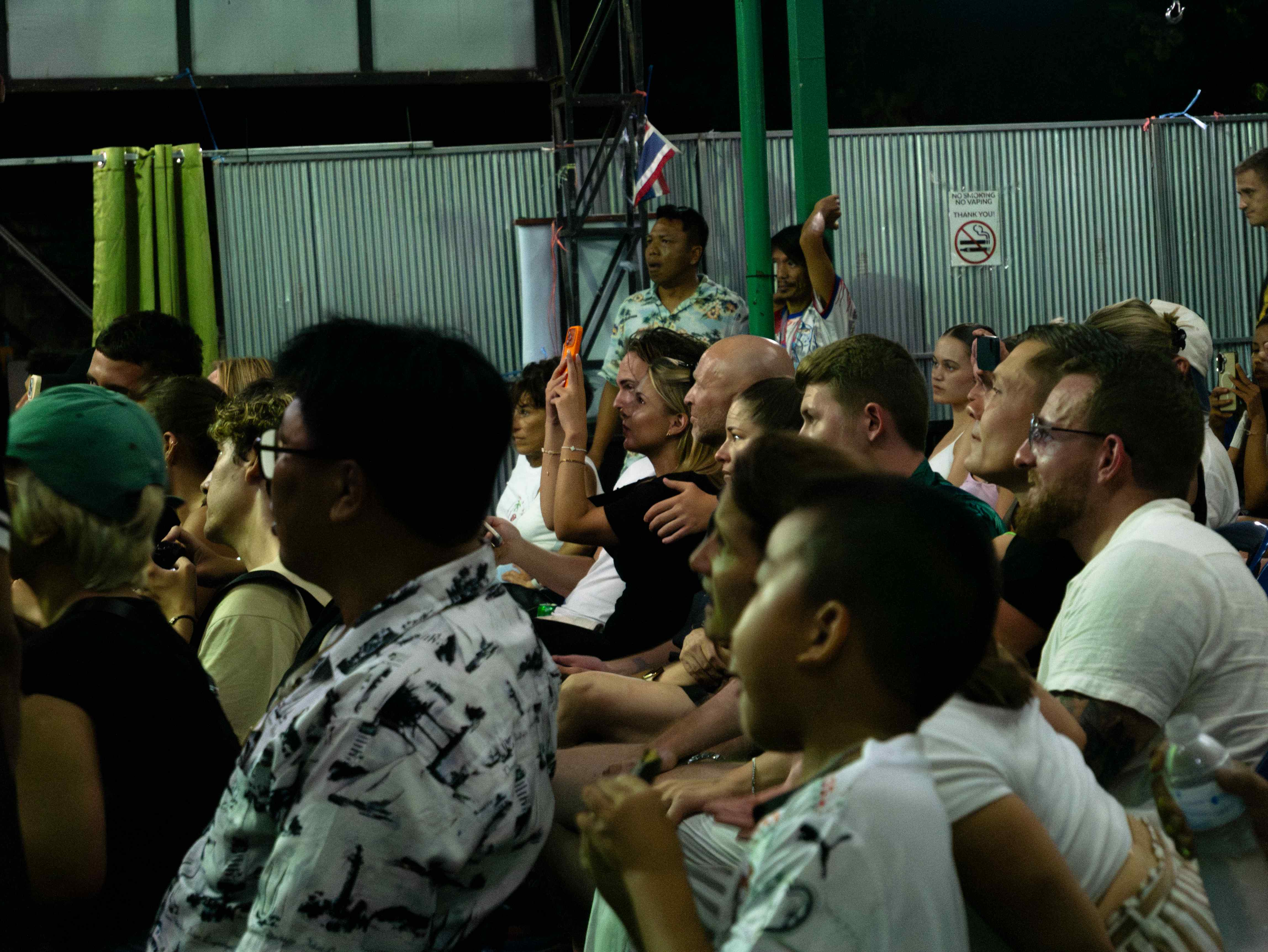 Crowd watching a traditional Muay Thai fight in Thailand